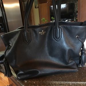 Kate Spade black Tote with two tassels.